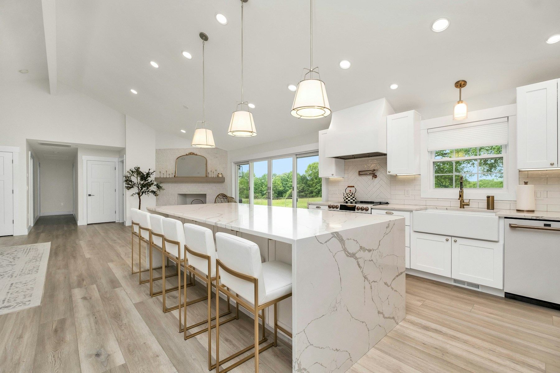Kitchen with a marble waterfall island